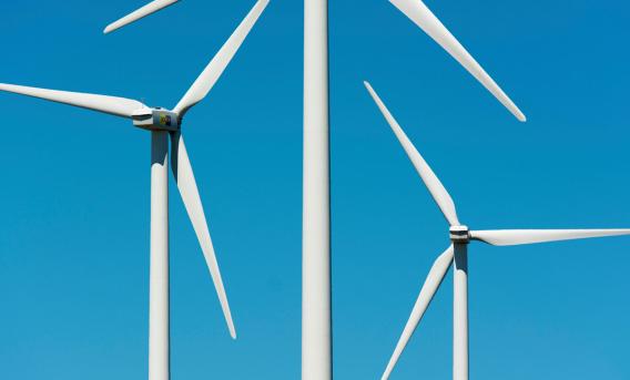 Wind turbines against blue sky by Jan van der Wolf via Pexels